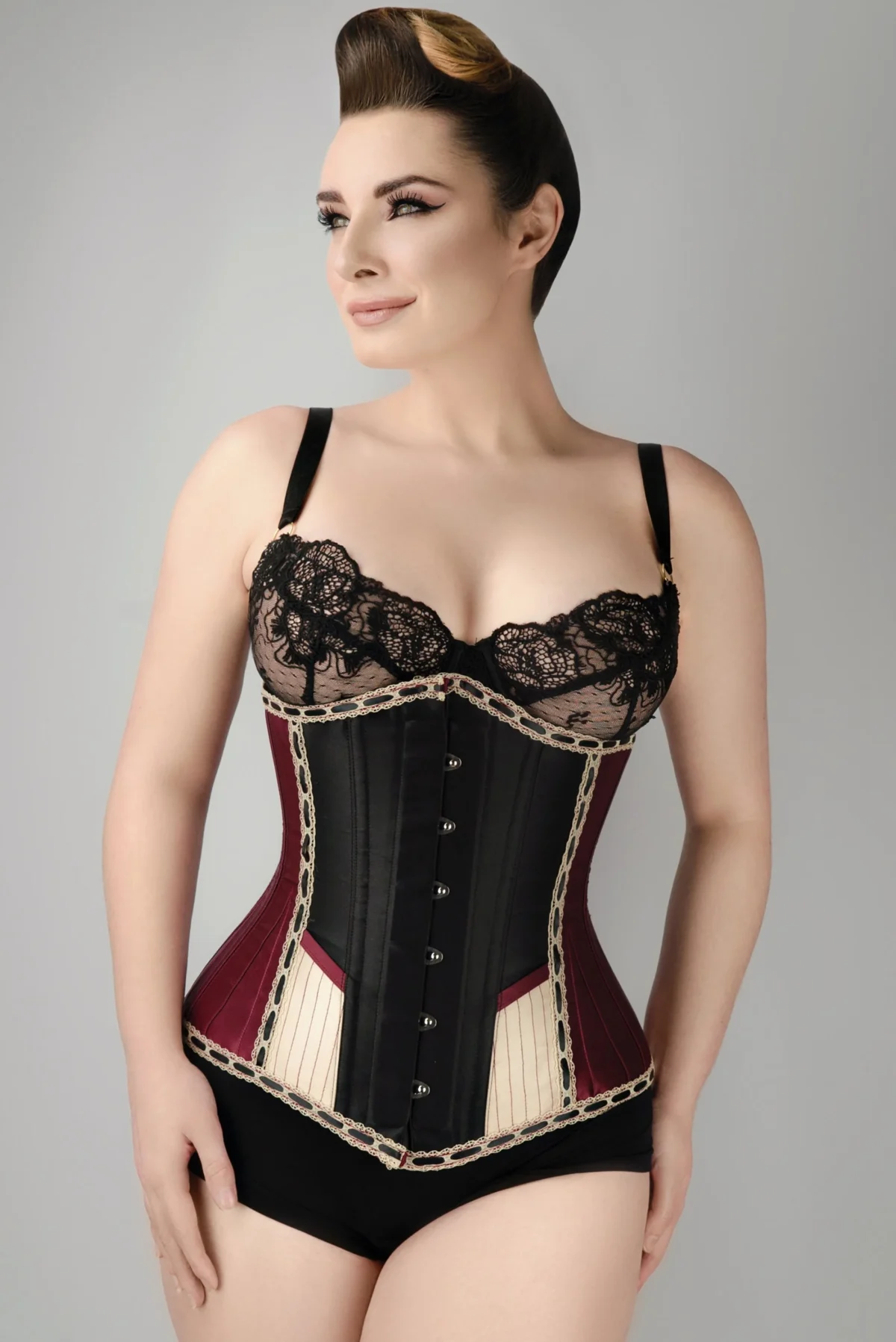 Style: Longline,Underbust Corset Features: Cord Lacing,Hip Gores,Steel Busk Colour: Burgundy Achievable Waist Reduction: 3-4" Pointed Underbust Fully Adjustable Structured Corset with Criss Cross Lacing Front and Back Modesty Panel Strong Corset Cord Lacing Strong Waist Tape 6 Suspender Loops Outer Material: 100% Polyester Lining: 100% Cotton Twill 10 x 4mm Lightweight Spiral Steel Bones, 4 x 7mm Lightweight Flat Steel Bones Busk Length: 12" (All Corset Sizes)